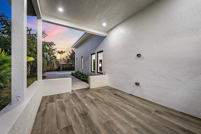 view of patio terrace at dusk