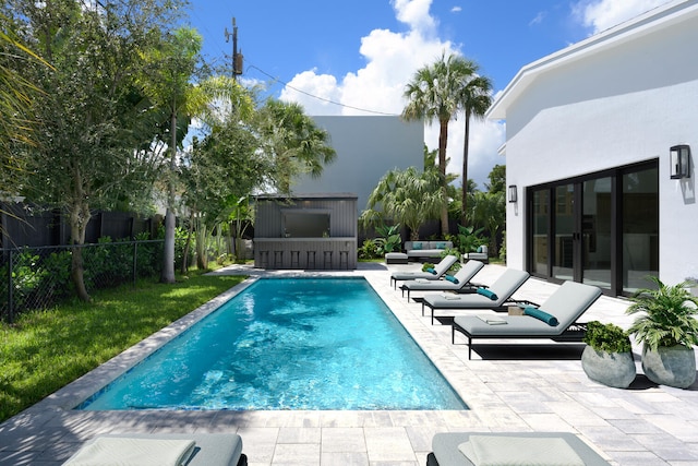 view of swimming pool featuring a patio area