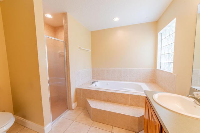 full bathroom with shower with separate bathtub, vanity, tile patterned flooring, and toilet