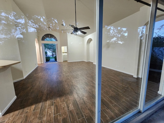 living room with hardwood / wood-style floors, ceiling fan, and lofted ceiling