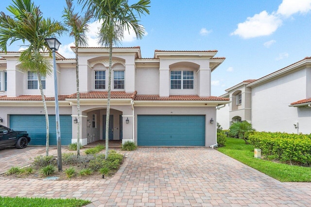 mediterranean / spanish-style home featuring a garage