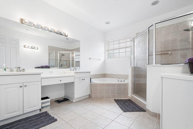 bathroom with tile patterned floors, vanity, and separate shower and tub