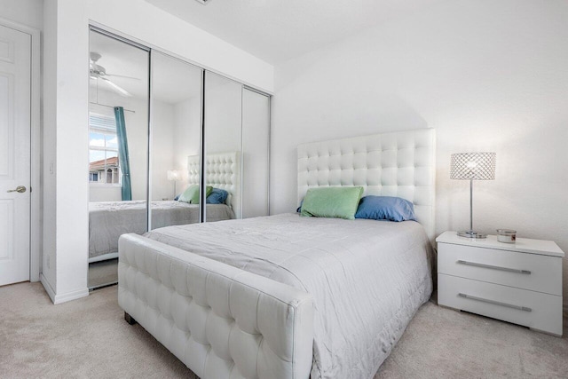 carpeted bedroom with a closet