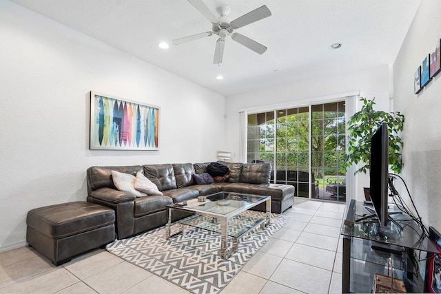 tiled living room featuring ceiling fan and a textured ceiling