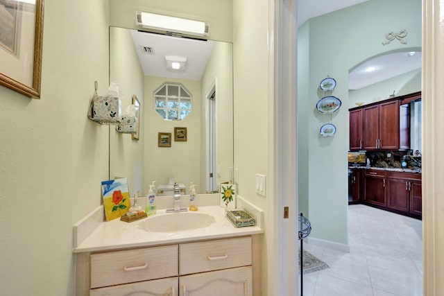 bathroom with tile patterned flooring and vanity