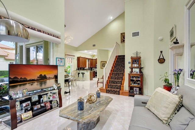 tiled living room with high vaulted ceiling