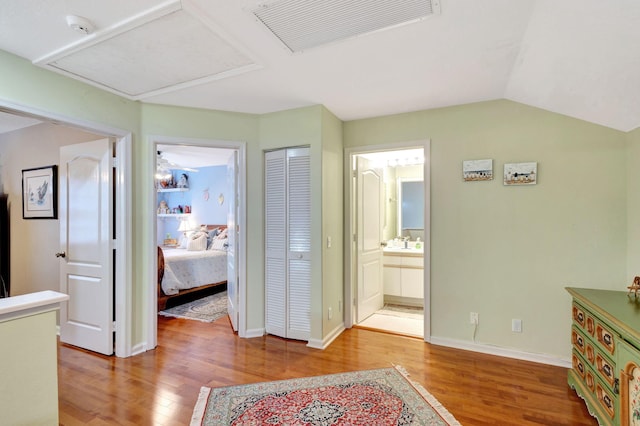 interior space featuring vaulted ceiling and hardwood / wood-style floors