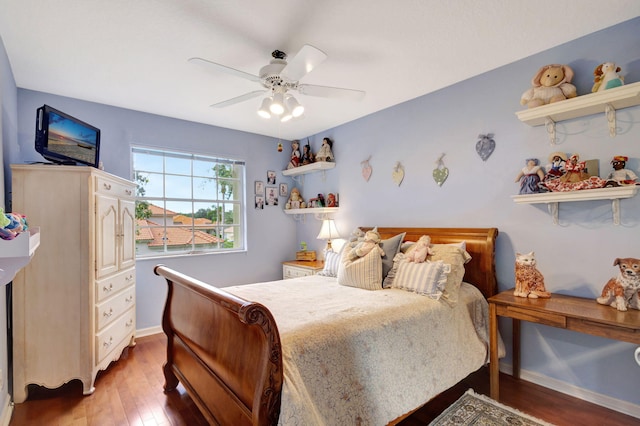 bedroom featuring ceiling fan and dark hardwood / wood-style floors