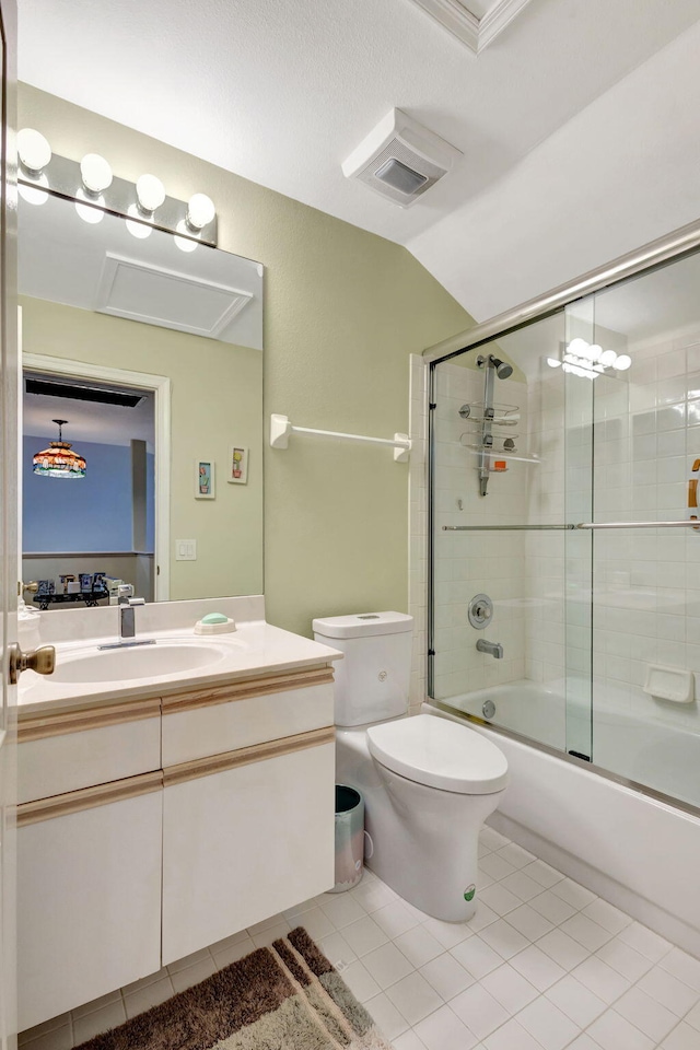 full bathroom featuring tile patterned floors, vanity, combined bath / shower with glass door, toilet, and lofted ceiling