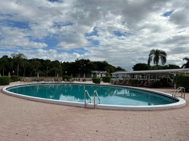 view of swimming pool with a patio