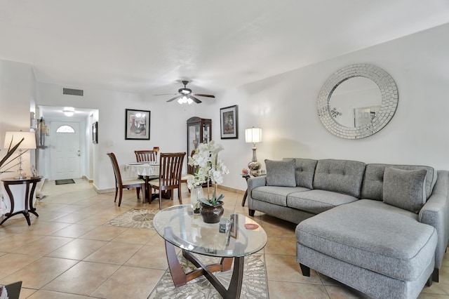 living room featuring ceiling fan and light tile patterned flooring