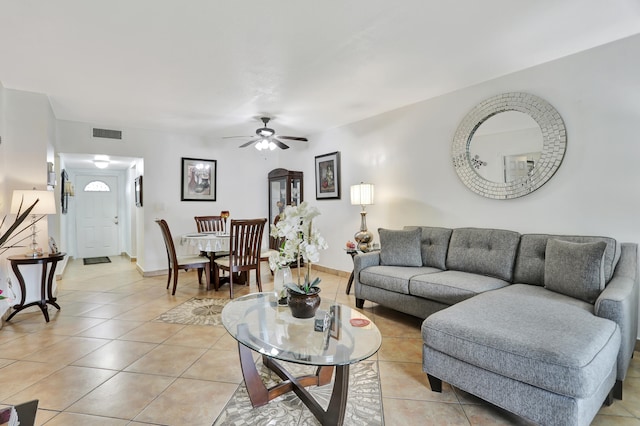 tiled living room featuring ceiling fan