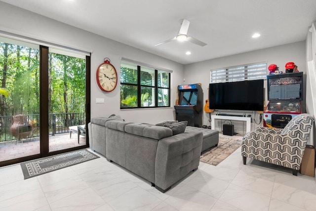 tiled living room with ceiling fan