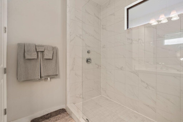 bathroom featuring tiled shower