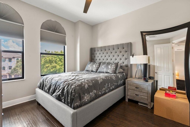 bedroom featuring ceiling fan and dark hardwood / wood-style floors