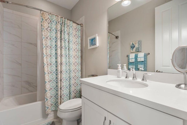 full bathroom featuring shower / bath combo with shower curtain, vanity, and toilet