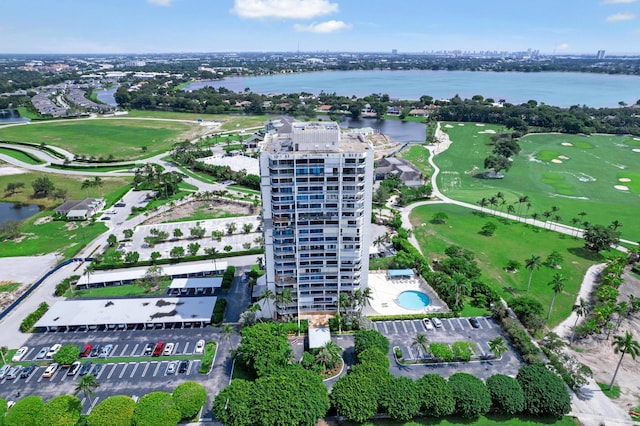 bird's eye view featuring a water view and view of golf course