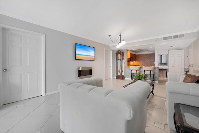 living area with light tile patterned floors, visible vents, and ornamental molding