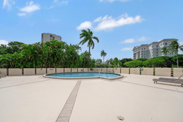 community pool with a patio