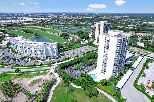 bird's eye view featuring a water view, a city view, and golf course view