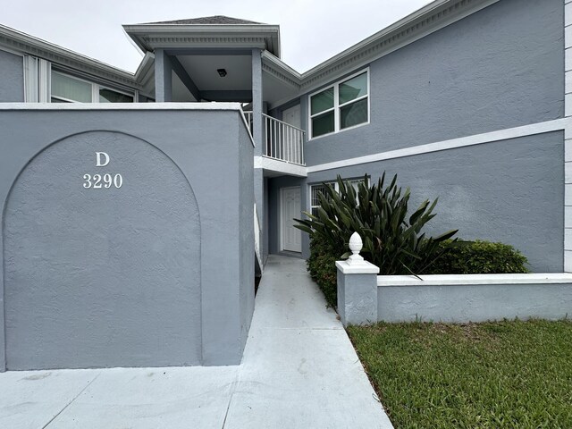 view of home's exterior with a balcony