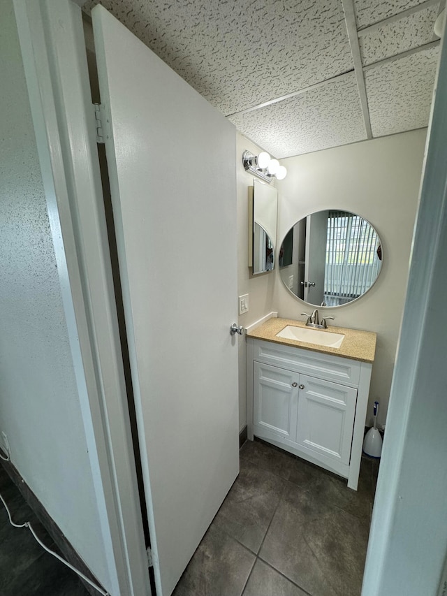 bathroom with tile patterned floors and vanity