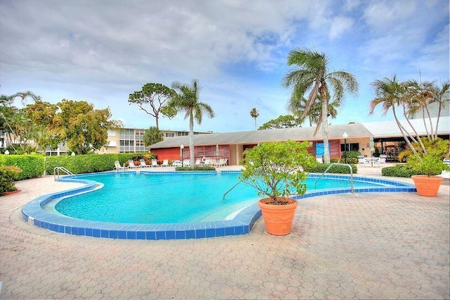 view of swimming pool featuring a patio area