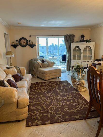 tiled living room with crown molding