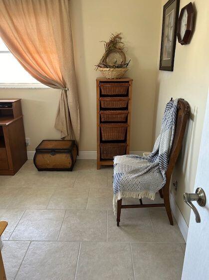 living area with light tile patterned floors