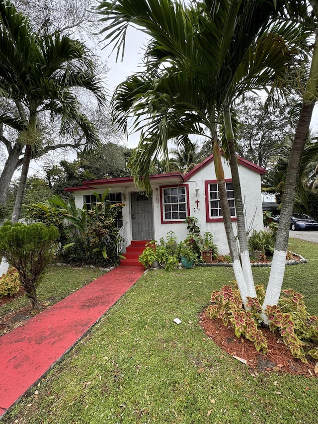 view of front of property with a front lawn