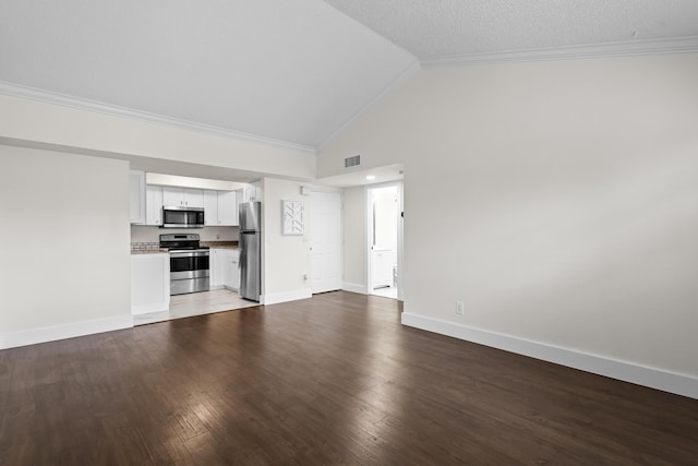 unfurnished living room featuring ornamental molding, visible vents, baseboards, and wood finished floors