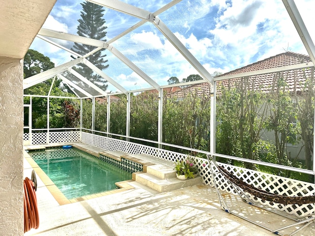 view of pool featuring a lanai