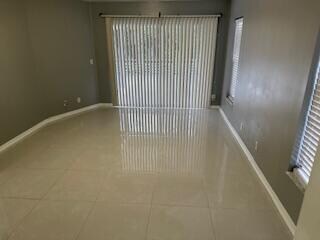 empty room featuring tile patterned flooring