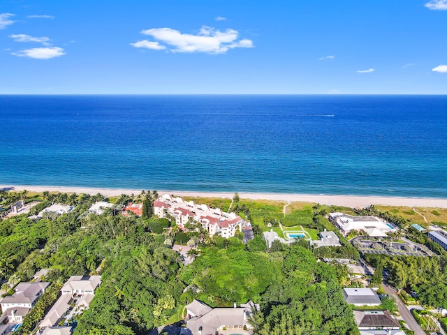 bird's eye view featuring a view of the beach, a water view, and a residential view