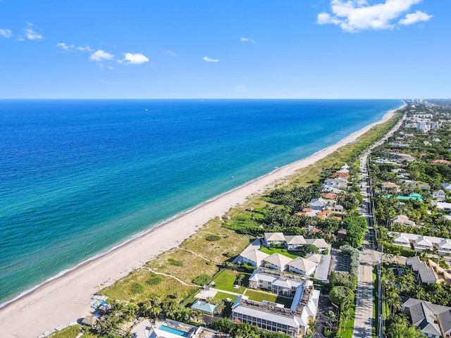 drone / aerial view with a view of the beach and a water view