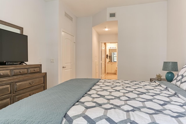 bedroom with connected bathroom