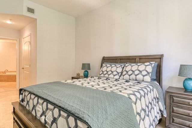 bedroom featuring connected bathroom