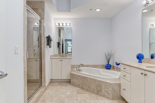 bathroom featuring vanity, separate shower and tub, and tile patterned flooring