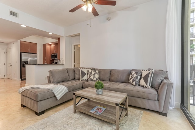 living room featuring ceiling fan