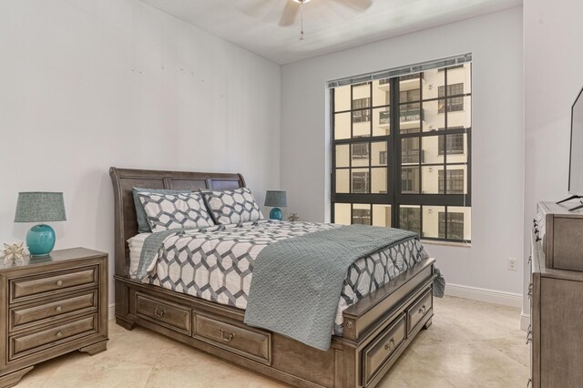 bedroom with light tile patterned floors and ceiling fan