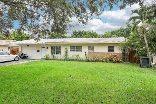 view of front of house with a front lawn and a garage