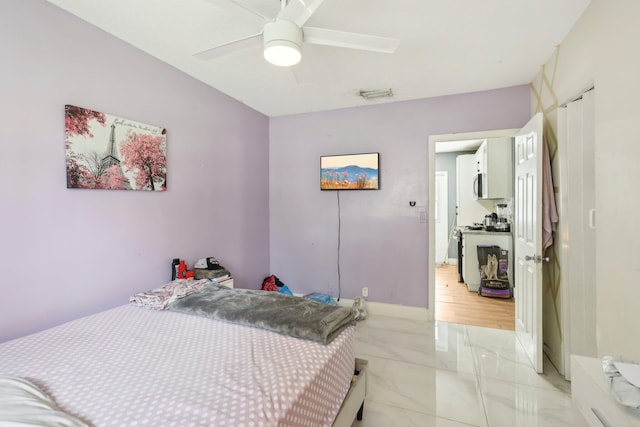 bedroom featuring ceiling fan and light tile patterned floors