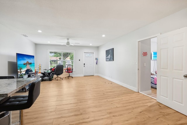 interior space featuring ceiling fan and light wood-type flooring