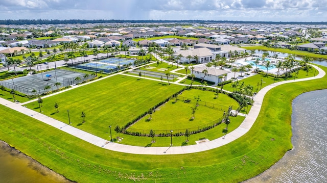 birds eye view of property with a water view