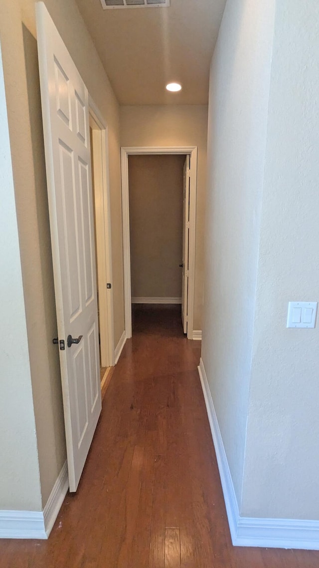 hall with dark hardwood / wood-style floors