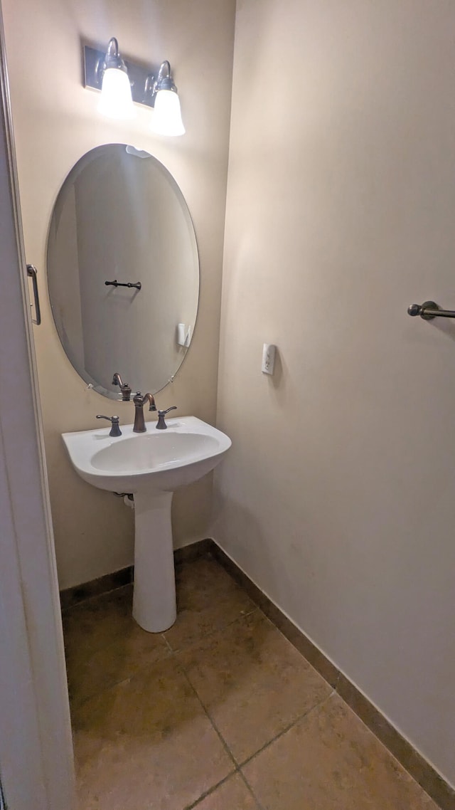 bathroom with tile patterned flooring