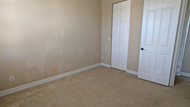 unfurnished bedroom featuring carpet