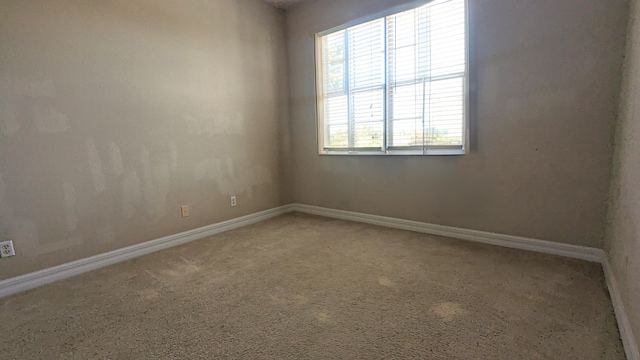 empty room featuring carpet flooring