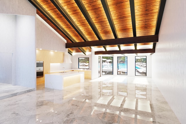 unfurnished living room with beam ceiling, sink, wood ceiling, and high vaulted ceiling