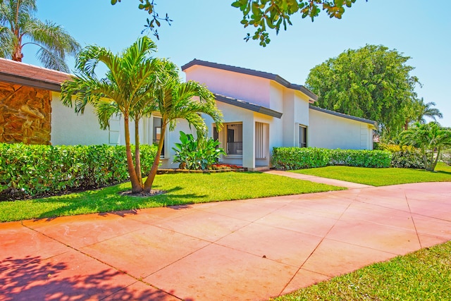 view of front of home with a front lawn